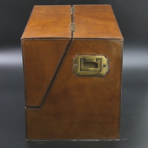 79 - A fine quality brown leather fitted stationary box with brass fittings.
24.5 cm high (closed) x 38 c... 