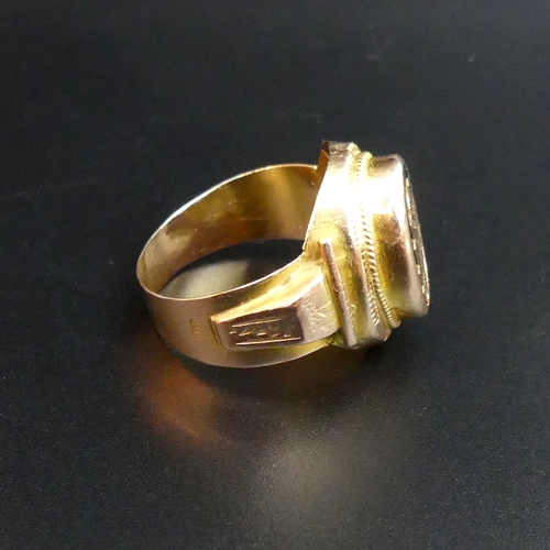 86 - A high carat gold signet ring, size X. 8.2 grams. Top 20.7 mm wide, the band 5.7 mm.
UK Postage £10