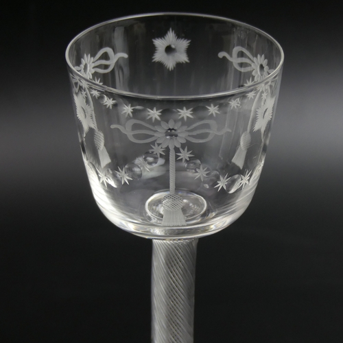 92 - An unusual antique engraved wine glass with an air twist stem. 16.5 cm tall x 7 cm in diameter.
UK P... 