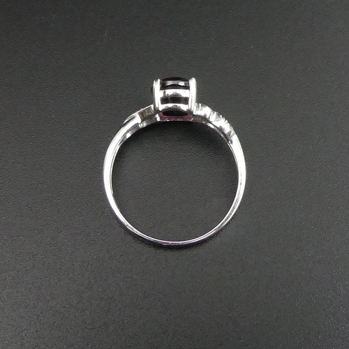 100 - 9ct white gold garnet and diamond ring, size P. 2.5 grams. Head 9.1 mm wide band 1.8 mm. UK Postage ... 