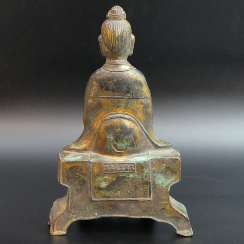 141 - A partially gilded metal figure of Buddha. 24 cm high.
UK Postage £15.