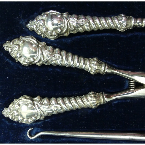 196 - Edwardian silver handled hair tongs, shoe horn and button hook. Birmingham 1906. Tongs 19.5 cm long.... 