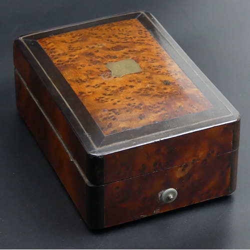 213 - Victorian Amboyna inlaid wooden, four air musical box. 13 x 8.5 5 cm. UK Postage £15.