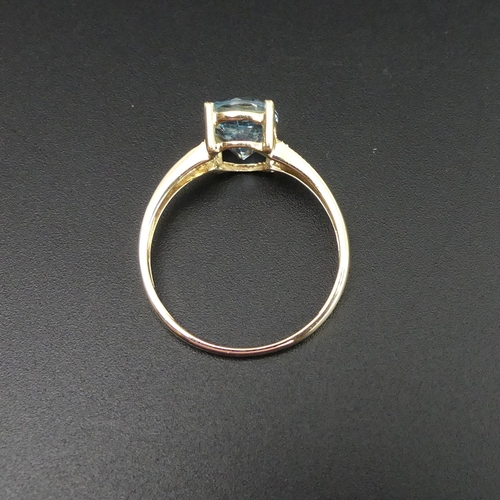 218 - 9 carat gold blue topaz and diamond ring, size T.  2.3 grams. Top 10 mm band 1.6 mm wide. UK Postage... 