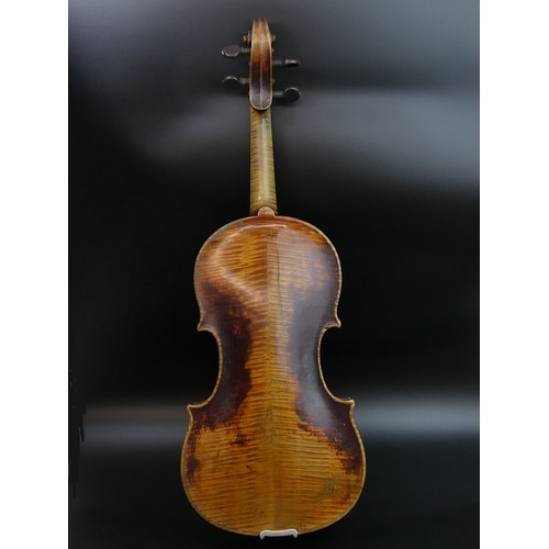 225 - A good old violin in playable un-touched condition, complete with hard case and bow. Length of back ... 