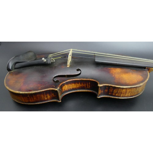 225 - A good old violin in playable un-touched condition, complete with hard case and bow. Length of back ... 