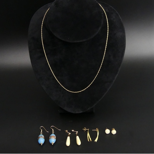 10 - Various gold earrings and a 9 carat gold chain. Largest earrings 4.5 cm, chain 46 cm. UK Postage £12... 