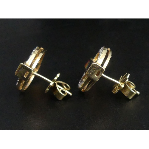 8 - 14 carat gold diamond and multi-coloured stone set pendant and chain, along with a matching pair of ... 