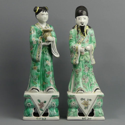 129 - A pair of Chinese famille verte porcelain figures. 32 cm. UK Postage £18.
