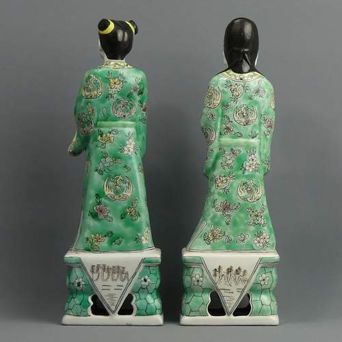 129 - A pair of Chinese famille verte porcelain figures. 32 cm. UK Postage £18.
