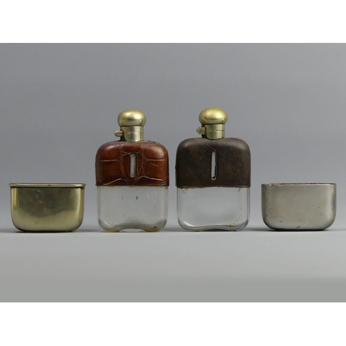 131 - Two Victorian glass, silver plate and leather hip flasks. 12 cm high. UK Postage £12.