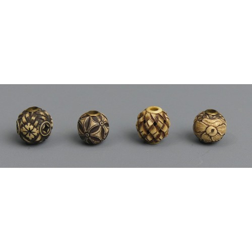 266 - 10 Japanese Meiji period carved Ojime ivory beads, one cinnabar lacquer and one peach stone example.... 