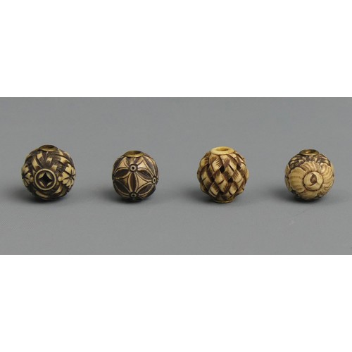 266 - 10 Japanese Meiji period carved Ojime ivory beads, one cinnabar lacquer and one peach stone example.... 