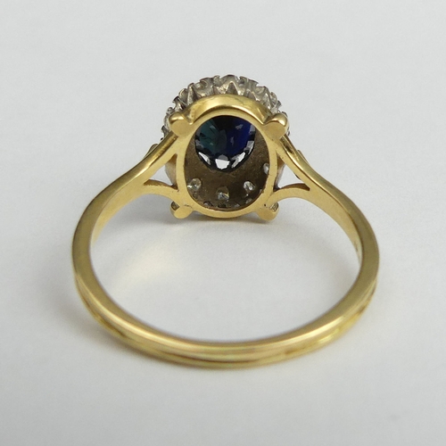 17 - 18 carat gold sapphire and diamond ring, 4.2 grams. Size R, 12.7 mm wide. UK Postage £12.