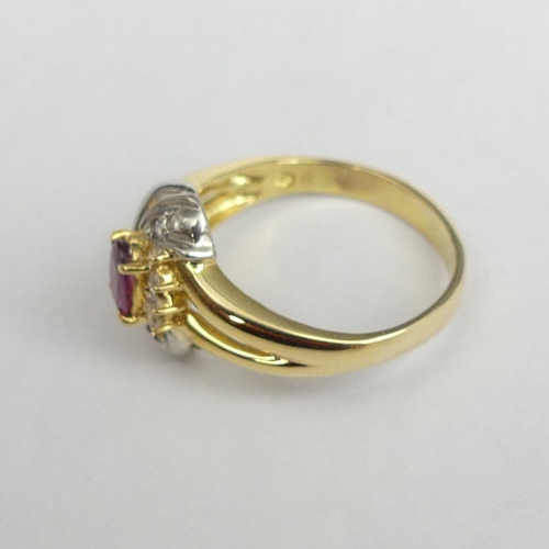 22 - 9 carat two colour gold ruby and diamond ring, 4.7 grams. Size P, 13.4 mm wide. UK Postage £12.