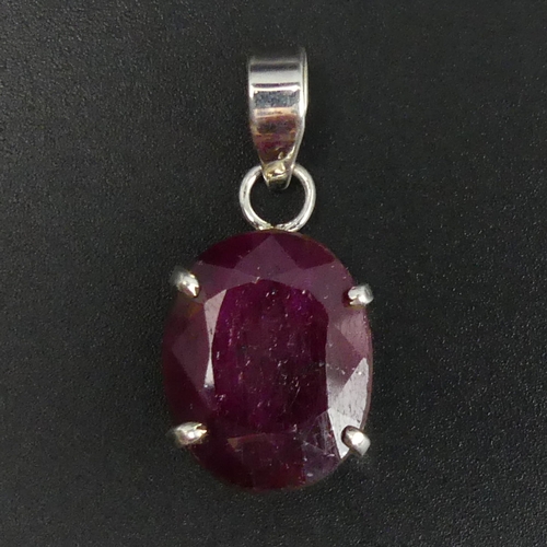 23 - Sterling silver large oval ruby set pendant, 6 grams. 25 mm (excluding bale) x 15.6 mm. UK Postage £... 