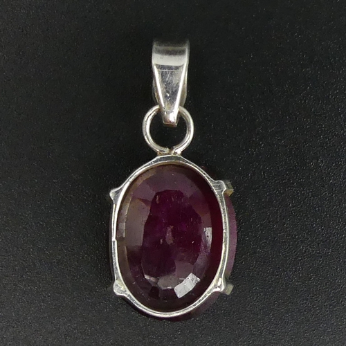 23 - Sterling silver large oval ruby set pendant, 6 grams. 25 mm (excluding bale) x 15.6 mm. UK Postage £... 