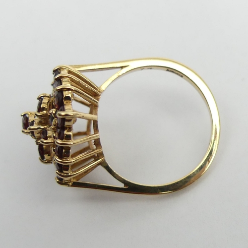 10 - 9ct gold garnet cluster ring, 4.8 grams, size N, 23.2 mm. UK Postage £12.