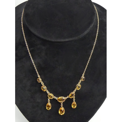 13 - 9ct gold citrine drop necklace, 9.3 grams. 41 cm long. UK Postage £12.