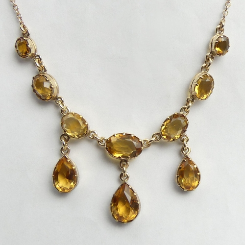13 - 9ct gold citrine drop necklace, 9.3 grams. 41 cm long. UK Postage £12.