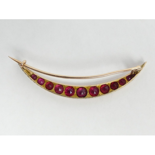 14 - 9ct gold faux ruby and diamond crescent form brooch, 2.9 grams. 50 mm. UK Postage £12.