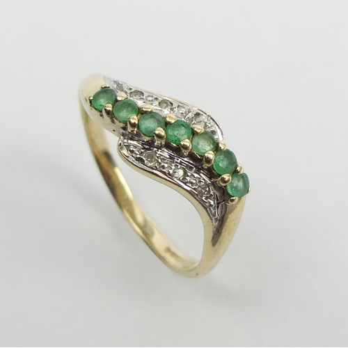 17 - 9ct gold emerald and diamond wave ring, 2 grams. Size O, 7.4 mm. UK Postage £12.