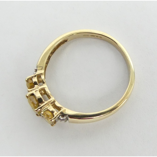 21 - 9ct gold citrine and diamond ring, 1.9 grams. Size M, 5.8 grams. UK Postage £12.