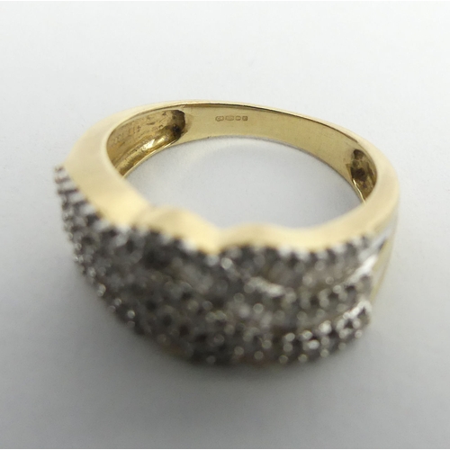 3 - 9ct gold diamond wave design ring, 2.7 grams. Size J, 7.4 mm. UK Postage £12.