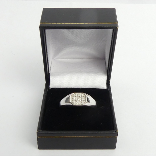 4 - 9ct white gold diamond set signet ring, 5.9 grams. Size T 1/2, 8.3 mm. UK Postage £12.