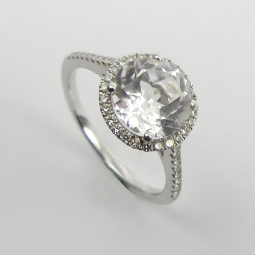 6 - 18ct white gold white topaz and diamond ring, 2.7 grams. Size M. UK Postage £12.