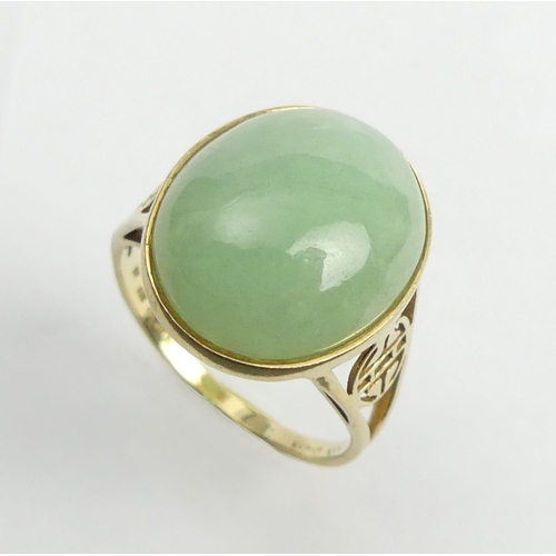 29 - 14ct gold celadon jade set ring, 4.3 grams. Size O, 17.1 mm. UK Postage £12.
