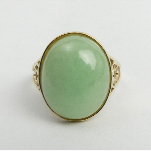 29 - 14ct gold celadon jade set ring, 4.3 grams. Size O, 17.1 mm. UK Postage £12.