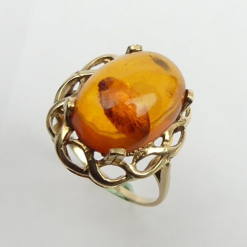 32 - 9ct gold amber set ring, 2.6 grams. Size N, 18.1 grams.  UK Postage £12.