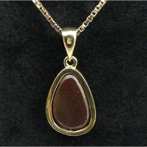 35 - 9ct gold opal doublet pendant and chain, 4.2 grams. 23 mm long. UK Postage £12.
