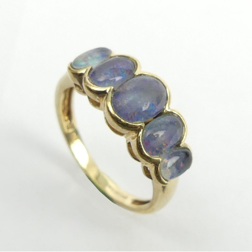 42 - 9ct gold opal doublet five stone ring, 2.6 grams. Size N, 8.1 mm. UK Postage £12.