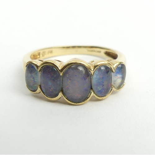 42 - 9ct gold opal doublet five stone ring, 2.6 grams. Size N, 8.1 mm. UK Postage £12.
