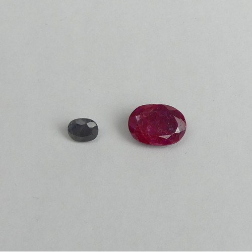 46 - 1.4 carat oval blue sapphire and a 6.6 carat oval ruby both certified. UK Postage £12.