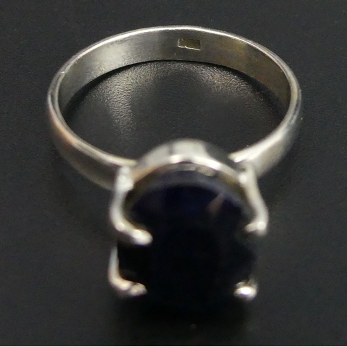 49 - Oval blue sapphire Sterling silver ring, 5.5 grams. Size T, 12.8 mm top. UK Postage £12.