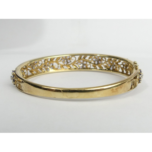 15 - 9ct gold diamond and pale tanzanite? hinged bangle, 19.9 grams. 11.7 mm. UK Postage £12.