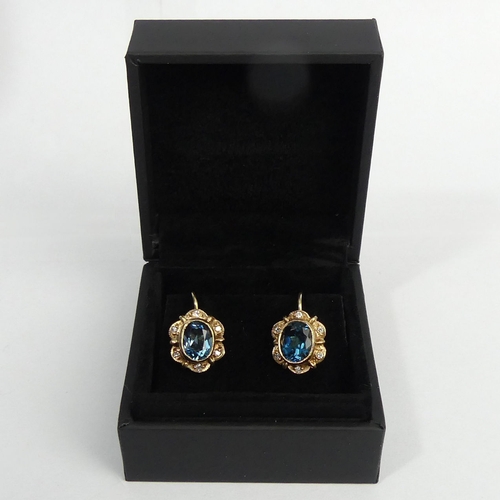 17 - A pair of blue topaz and diamond earrings,, 3.6 grams. 10.5 x 13 mm. UK Postage £12.