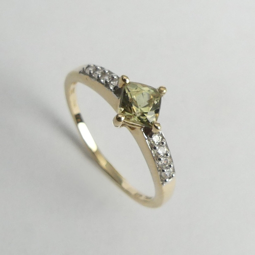 27 - 9ct gold topaz and citrine ring, 2 grams. Size Q, 7.7 mm. UK Postage £12.