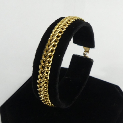 53 - 9ct gold double curb link bracelet, 4.9 grams. 18 cm x 6.9 mm. UK Postage £12.