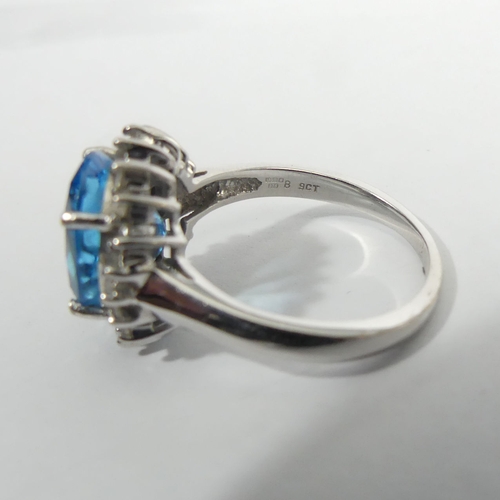57 - 9ct white gold topaz and diamond ring, 5.4 grams. Size R, 16 mm. UK Postage £12.