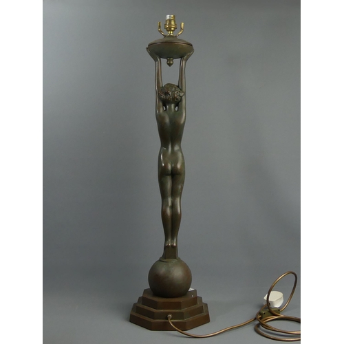 294 - A bronzed metal ware Art Deco style table lamp, 78 cm. UK Postage £20.