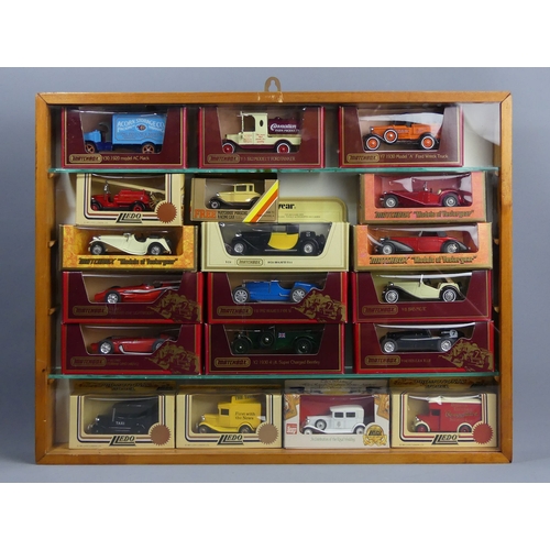 307 - Five wood and glass display cabinets housing Matchbox and Lledo die-cast vehicles in their boxes. Co... 