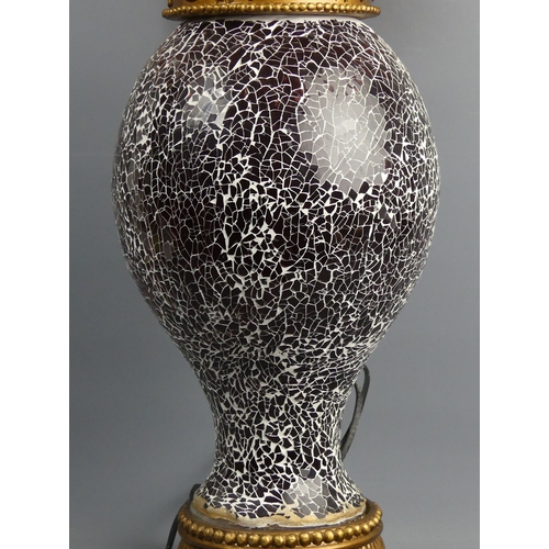 326 - An ornate black crackle glass and gilt wood table lamp with a silk shade. 71 cm high. Collection onl... 