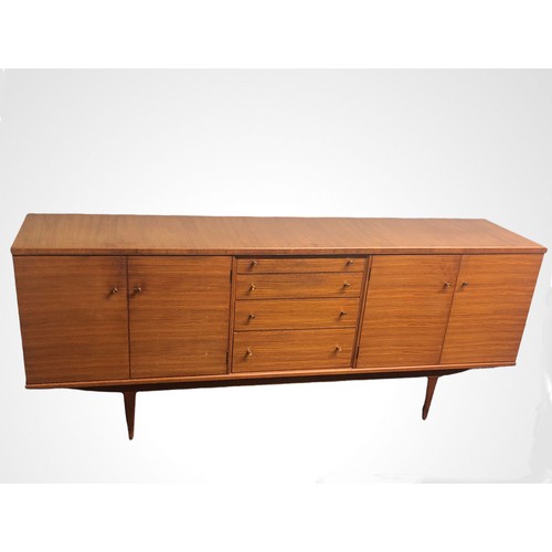 335 - A stylish 1970's teak sideboard by Alfred Cox. 200 cm long x 80 high x 48 deep. Collection only.