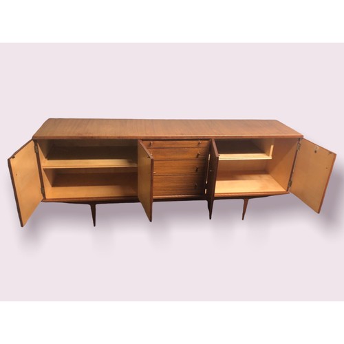 335 - A stylish 1970's teak sideboard by Alfred Cox. 200 cm long x 80 high x 48 deep. Collection only.