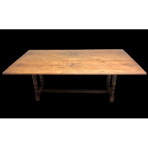 334 - A good quality oak refectory table with extendable flaps and brass fitments. 185 cm x 50 cm (closed)... 