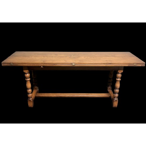 334 - A good quality oak refectory table with extendable flaps and brass fitments. 185 cm x 50 cm (closed)... 